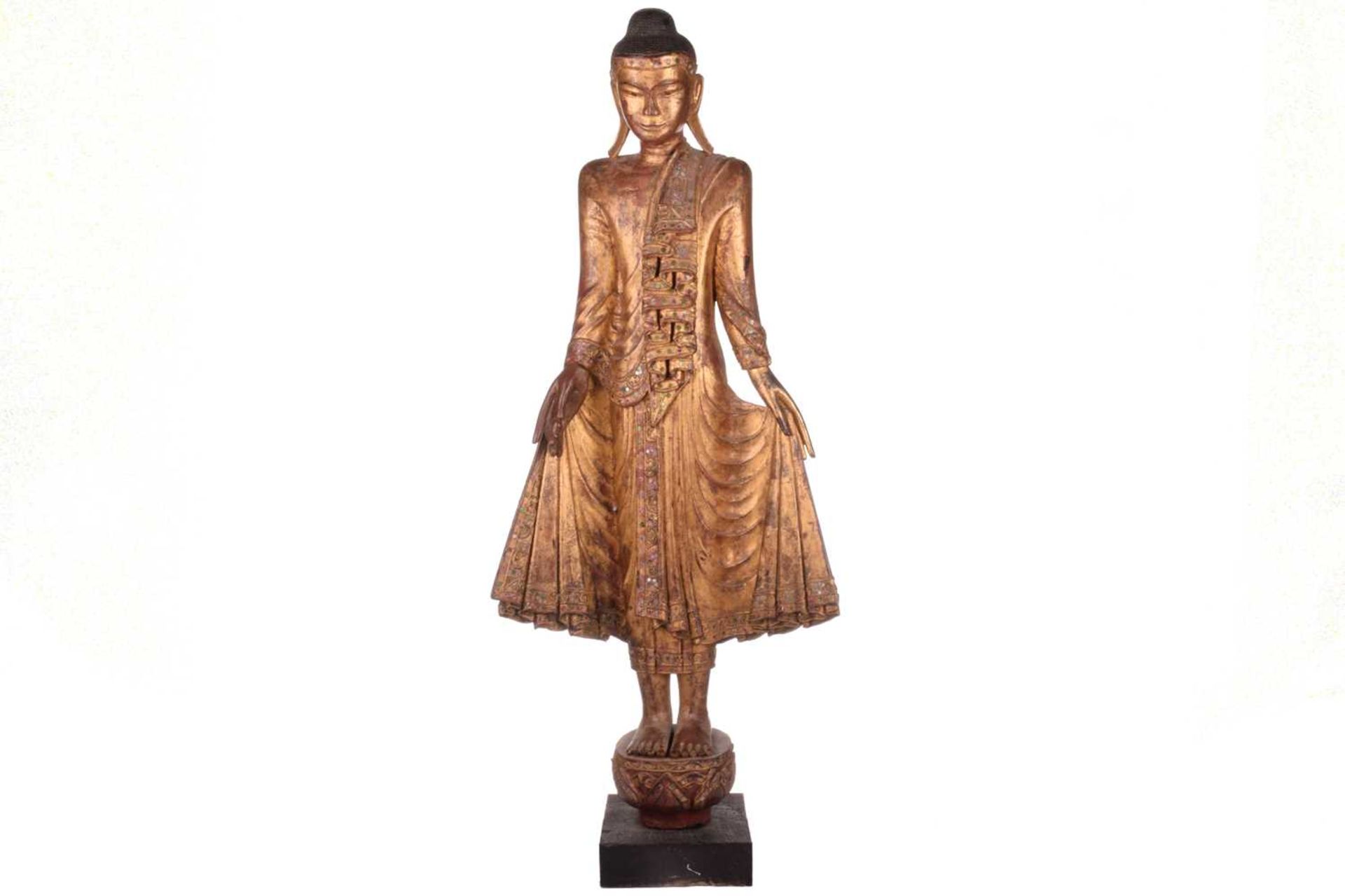 A Burmese carved and gilt wood standing Buddha in varada mudra, 19th century, set with jewels and