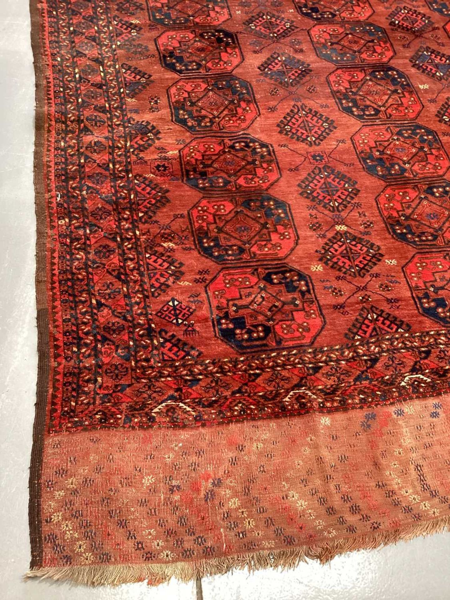 A large antique "Old country house" red ground Afghan carpet, with three rows of elephant foot - Image 6 of 28