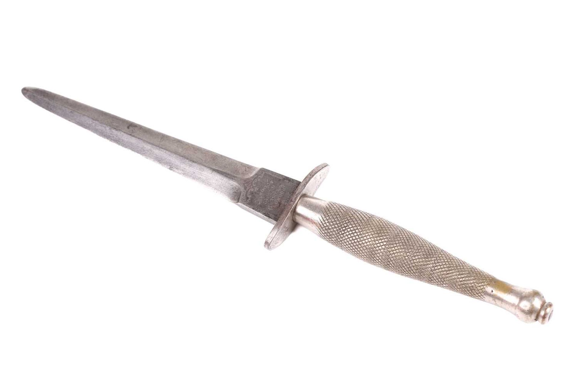 A Fairburn Sykes First Pattern commando Fighting Knife, with straight double-edged blade marked