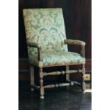 An 18th-century upholstered open armchair, on turned stretchered supports, 106 cm x 62 cm, the