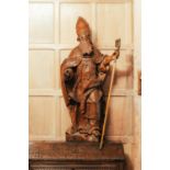 A 16th-century Flemish oak carved statue of a Bishop Saint, with later carved hands and staff, 123