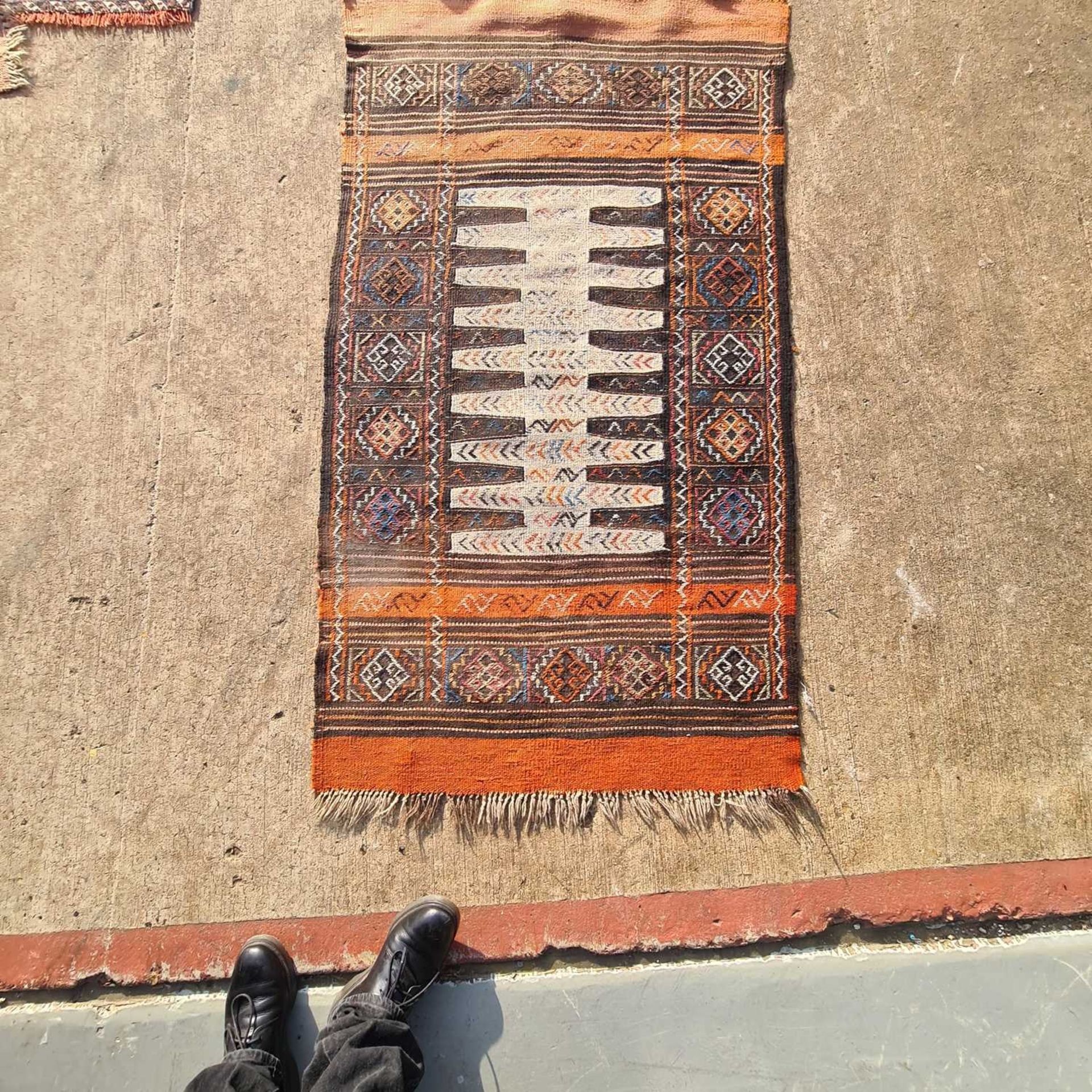 A red ground antique Tekke Turkoman rug, 160 cm x 116 cm, together with three soumak worked jaijim - Image 2 of 6