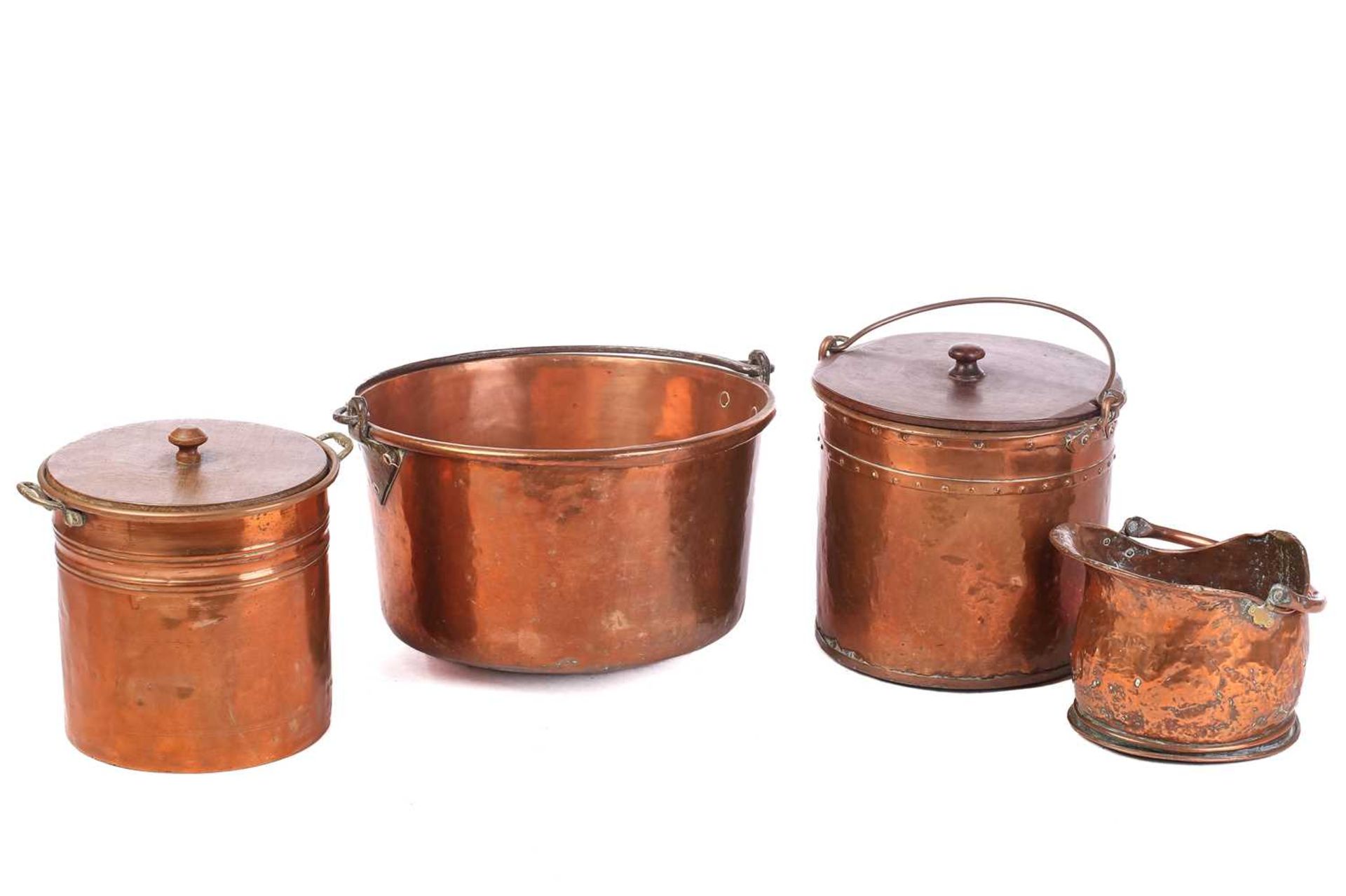 A large copper swing-handle pan, 30 cm high x 49 cm diameter, together with two cylindrical copper