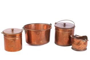 A large copper swing-handle pan, 30 cm high x 49 cm diameter, together with two cylindrical copper