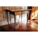 An 18th century Continental oak side table, with geometric carved frieze drawers on square section