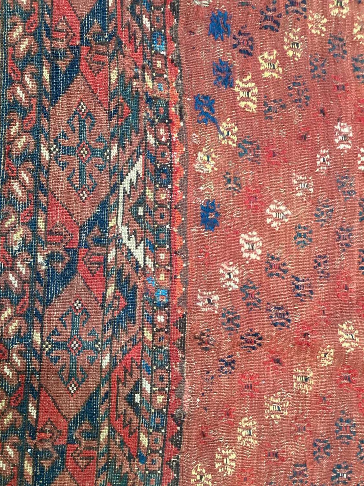 A large antique "Old country house" red ground Afghan carpet, with three rows of elephant foot - Image 24 of 28