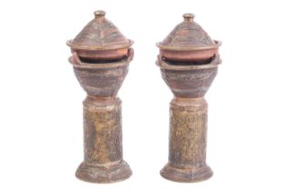 Two vintage pottery standing tagine pots, with applied metal covers and cylindrical stands for