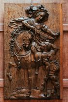 A 17th-century carved-wood figure group, depicting Saint Martin of Tours on horseback dividing his