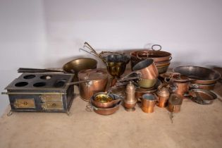 A large collection of copper pans, kettles, preserve pans, measures, jugs, and other items, together