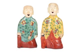 Two similar Chinese porcelain 'Laughing Boy' incense burner figures, late Qing /Republic era, each