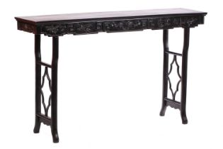 A Chinese carved Hongmu (Rosewood) altar table, Qing Dynasty, 19th century, with a plain panelled