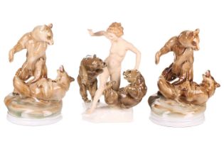 A Hutschenreuther porcelain figure group of a female nude playing with a pair of brown bears, signed