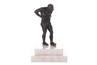 A patinated bronze figure of Atlas, first half of the 19th century, on a later stepped marble