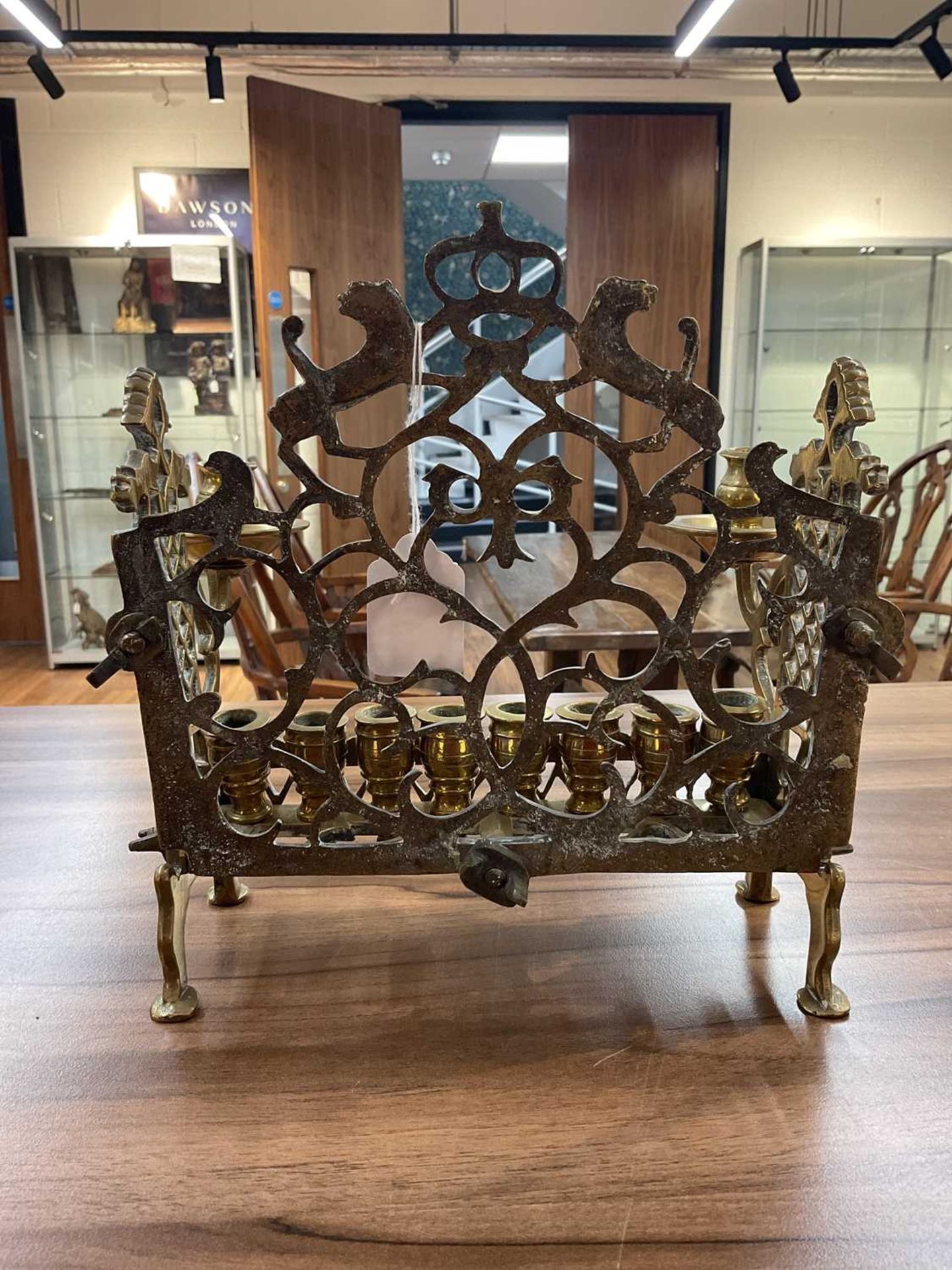 An 18th century Dutch/German brass menorah, with row of eight sconces and side lights, fretwork - Image 7 of 8