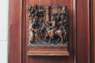 A 16th-century Flemish carved and pierced oak panel, depicting Christ on a donkey with attendant