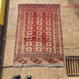 A red ground antique Tekke Turkoman rug, 160 cm x 116 cm, together with three soumak worked jaijim