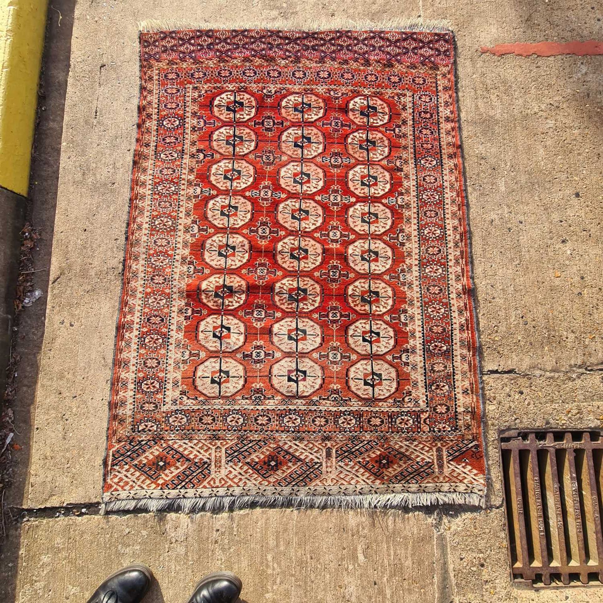 A red ground antique Tekke Turkoman rug, 160 cm x 116 cm, together with three soumak worked jaijim