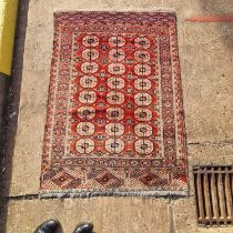 A red ground antique Tekke Turkoman rug, 160 cm x 116 cm, together with three soumak worked jaijim