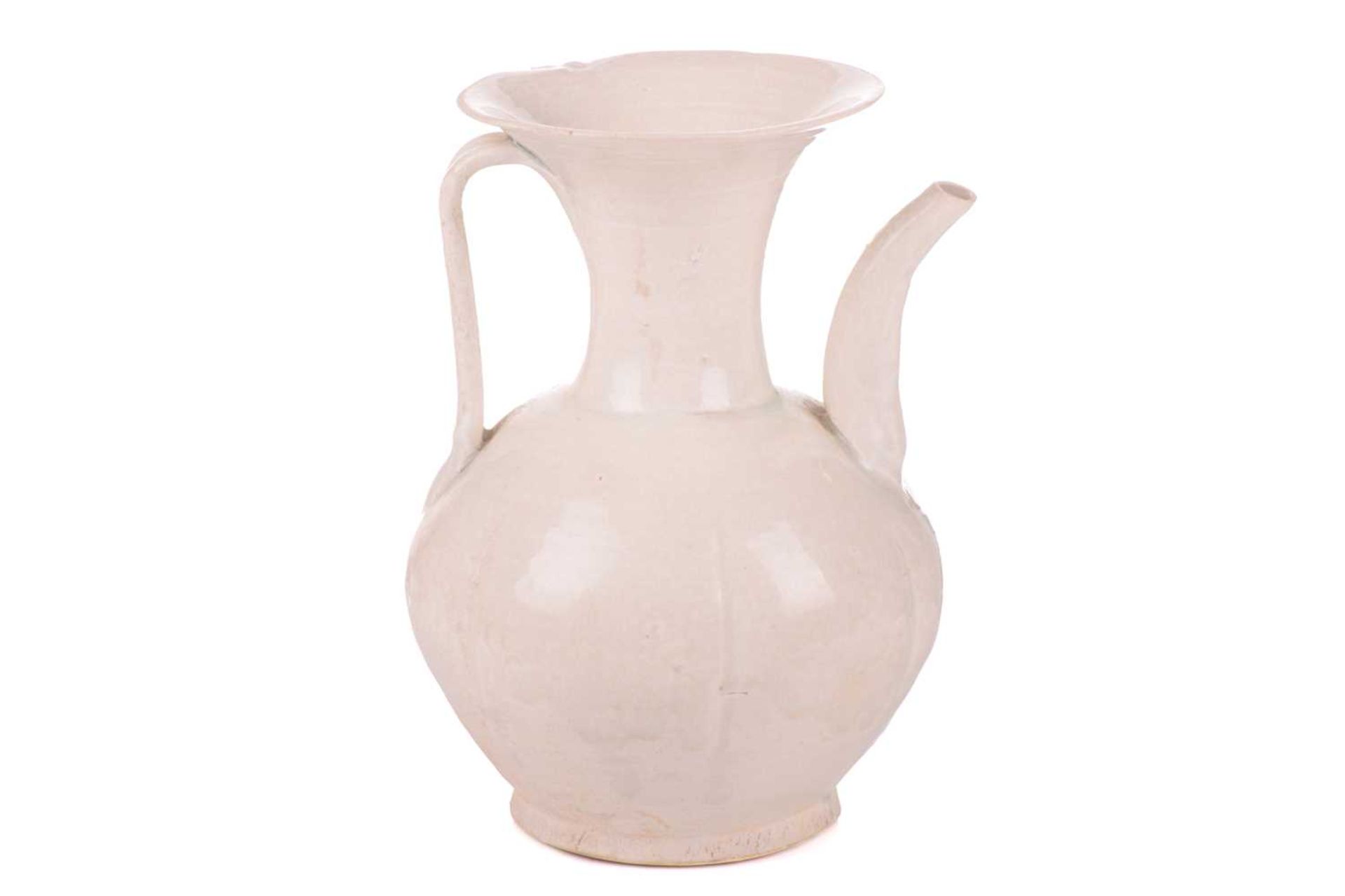 A Chinese Qinbai glazed porcelain baluster ewer, Song Dynasty of Islamic shape with flared mouth