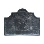 A 17th century style cast iron fire back, with shaped top, depicting a crown over figures at a