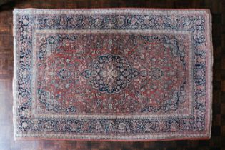 A Kashan rug with central medalion within borders, 202 x 133cm (2) Provenance: The contents of The