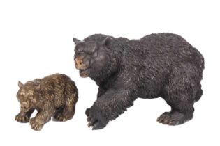 A twentieth-century large bronze figure of a bear, 20 cm high, and a smaller similar brass bear.