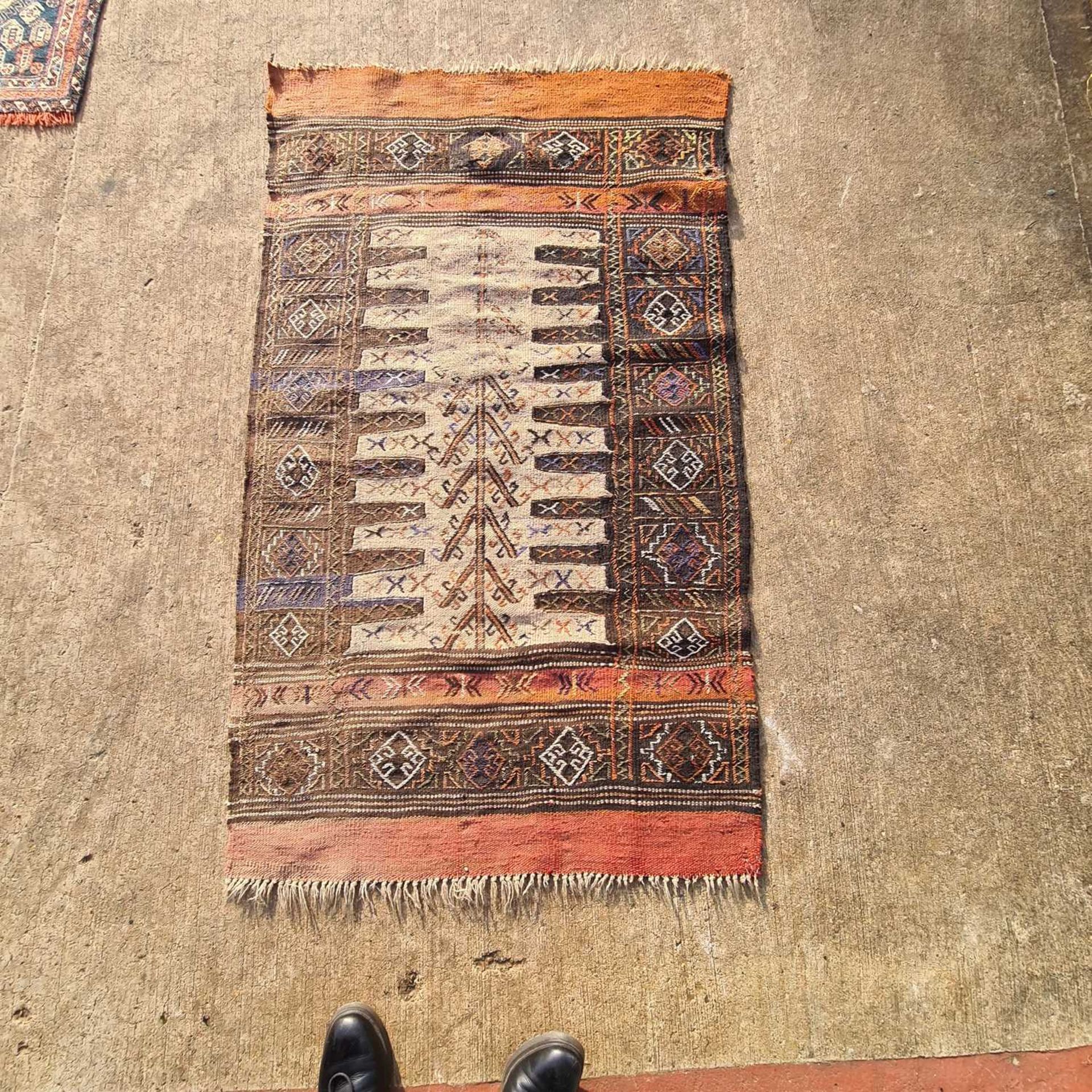 A red ground antique Tekke Turkoman rug, 160 cm x 116 cm, together with three soumak worked jaijim - Image 6 of 6