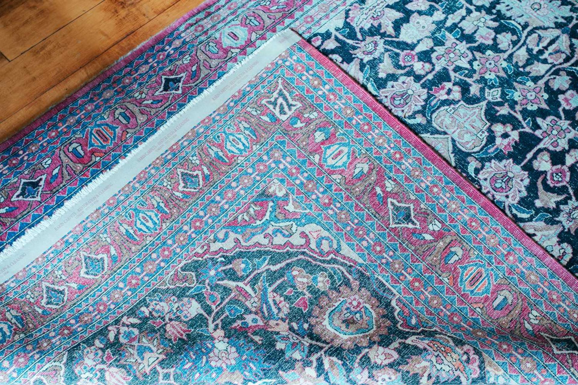 An antique black/blue ground Kerman carpet, with a central star and corners with multiple vines - Image 3 of 3