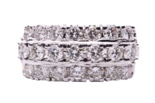 A diamond dress ring, set with three rows of round brilliant cut diamonds with a total estimated