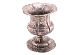 A white metal lobed chalice, of flared form on a spreading domed base decorated with stylised