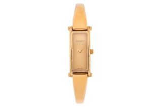 A Gucci gold-plated stainless steel lady's quartz wristwatch Model: 1500L Serial: 10317620 Case