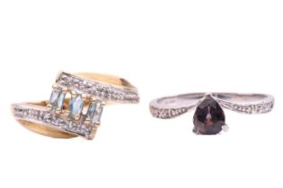 Two gem-set rings; the first set with a pear shape tourmaline with diamond set shoulders, with