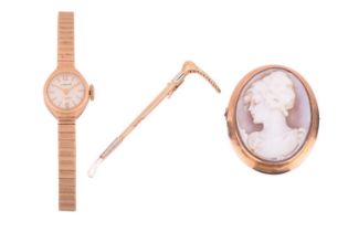 A wristwatch, a riding crop bar brooch and a cameo brooch; the 9ct gold ladies wristwatch features a