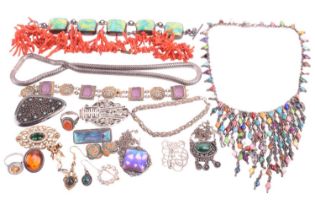 A quantity of white metal and costume jewellery; including examples of a citrine halo ring with