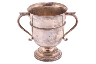 A silver presentation cup by Weir and Sons with twin handles, of flared form with a beaded border on