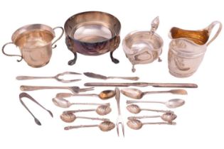 A mixed collection of silver and plate comprising a silver two-handled cup, a George III silver milk