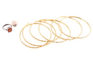 A set of six Indian bangles, together with a single earring and a ring; the closed bangles with