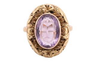 An amethyst dress ring, comprising an oval-cut amethyst of light purple colour, collet-set within