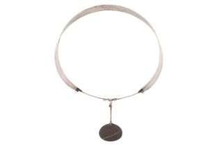 Torun - an early 'Neck Ring' with beach pebble, late 1950s, comprising a hand planished tension