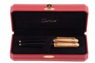 Pasha de Cartier - a ballpoint pen and a fountain pen set, both have lacquered barrels and fluted