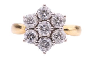 A diamond cluster ring, set with seven round brilliant cut diamonds with a total estimated diamond