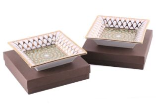 A pair of Patek Philippe VIP Limoges porcelain ashtrays, circa 2017, overall decorated in gilt,