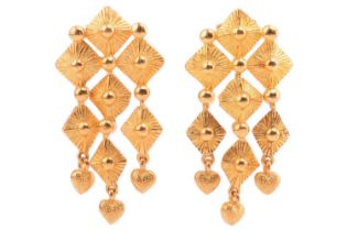 A pair of high-carat pendant earrings of geometric design, consisting of squares with sunburst