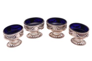 A set of four George III silver salts by Robert Hennell I of oval form with pierced gadrooned