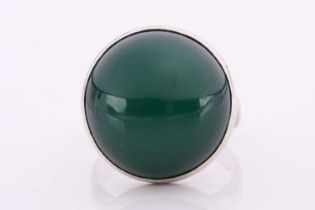 Georg Jensen - a green agate cabochon ring, collet-set to a tapering D-section shank, designed by