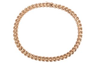 A fancy link necklace, comprising a series of hinged and repeating hollow links in the shape of a