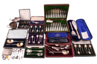 A quantity of flatware comprising a pair of silver gilt apostle spoons, a silver serving spoon, five