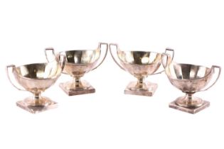 A set of four George III silver salts, with gilt interior, two-handled and of round form with a