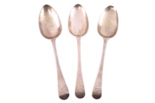 A matched set of three George III silver serving spoons, Old English pattern engraved with the