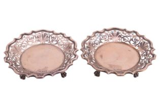 A pair of heavy silver sweet meat dishes by Walker & Hall, of round form with pierced borders on